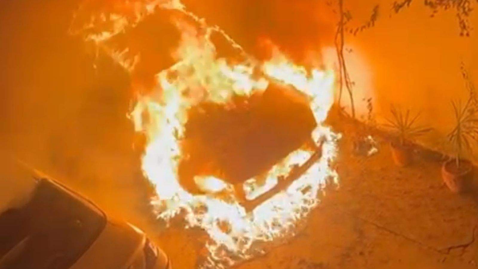 A Swift car parked outside a house in Jalandhar caught fire.