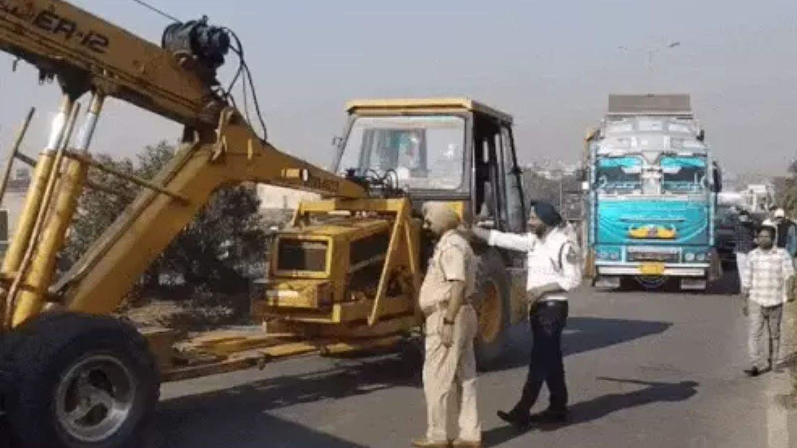 A paint-laden truck collided with a school bus and a roadways bus in Jalandhar, blocking the highway.