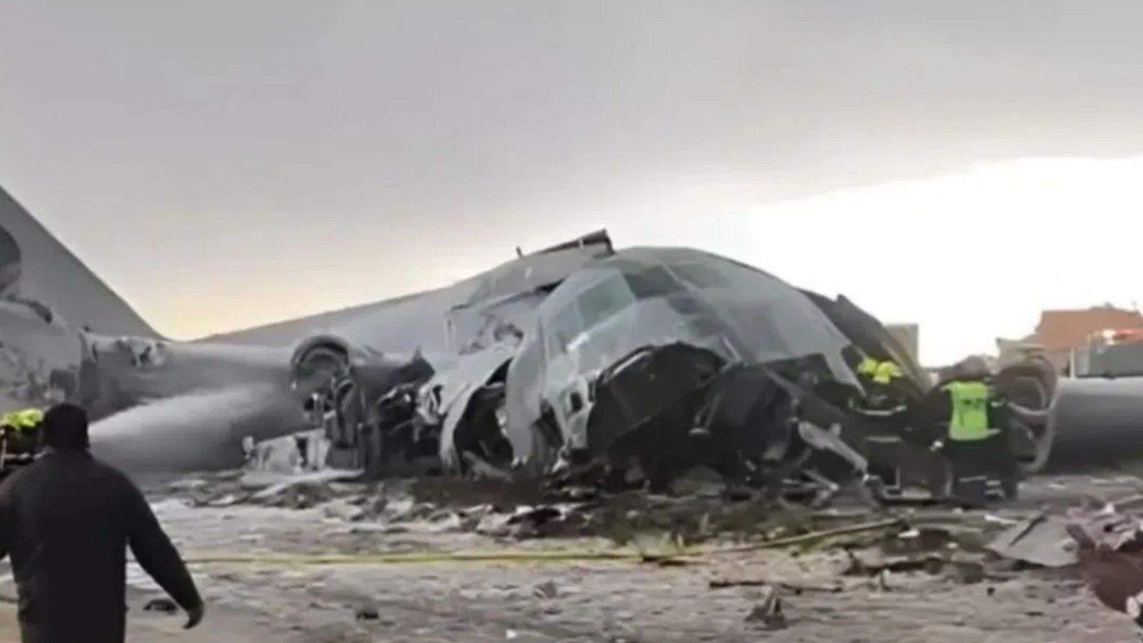 Air Force plane carrying currency notes crashes in bad weather, killing 15; banknotes scattered on the road