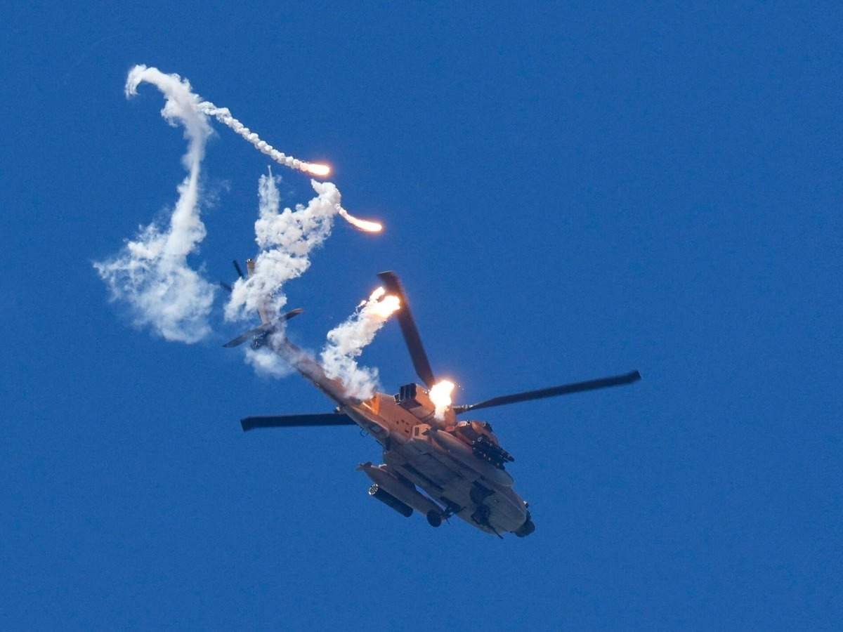 US Apache helicopter crashes near Strait of Hormuz; both pilots safe; tensions rise amidst Iran-Israel standoff.